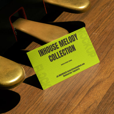 business card mockup leaning on a pedal piano