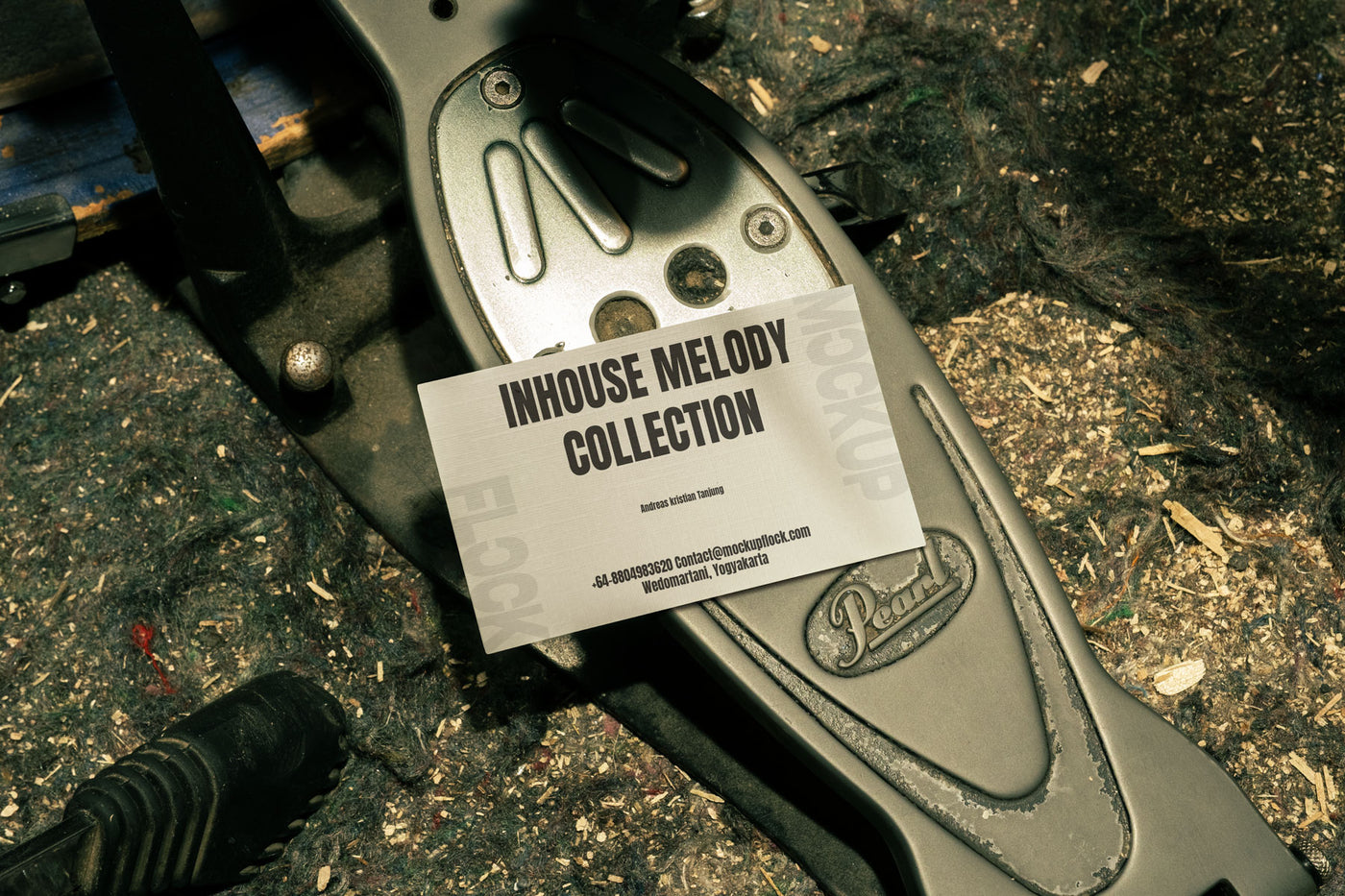 business card mockup leaning on a pedal drums