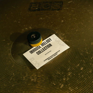 business card mockup leaning on a cymbal drums