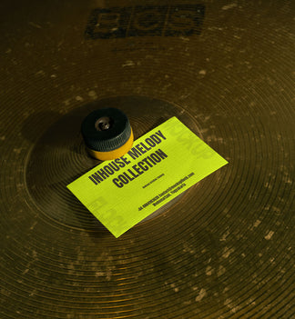 business card mockup leaning on a cymbal drums