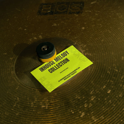 business card mockup leaning on a cymbal drums