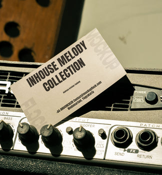 business card mockup leaning on a equalizer