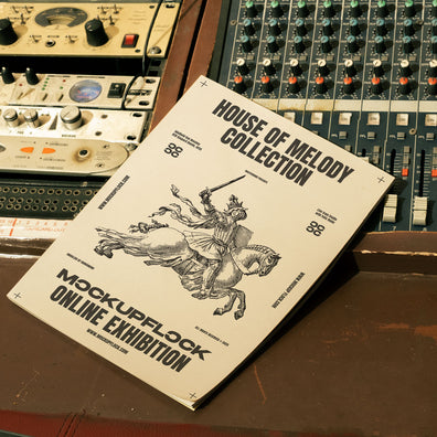 magazine mockup leaning on a analog mixer