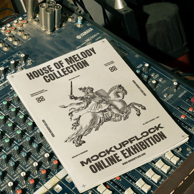 magazine mockup leaning on a analog mixer