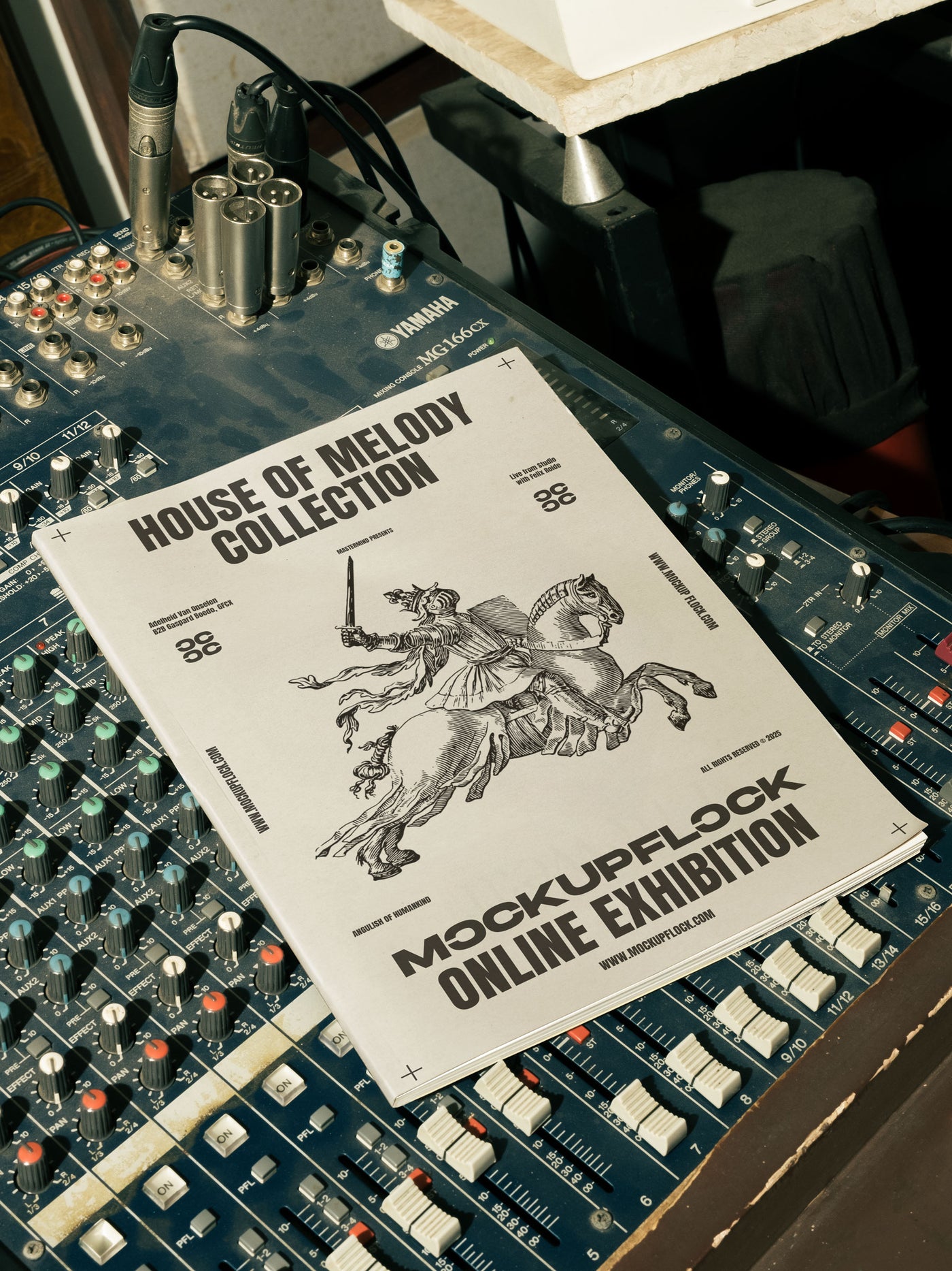 magazine mockup leaning on a analog mixer