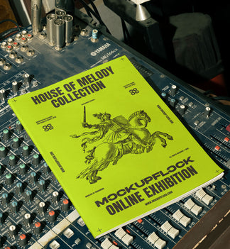 magazine mockup leaning on a analog mixer