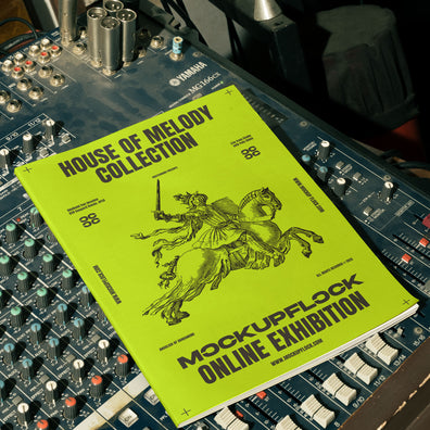 magazine mockup leaning on a analog mixer