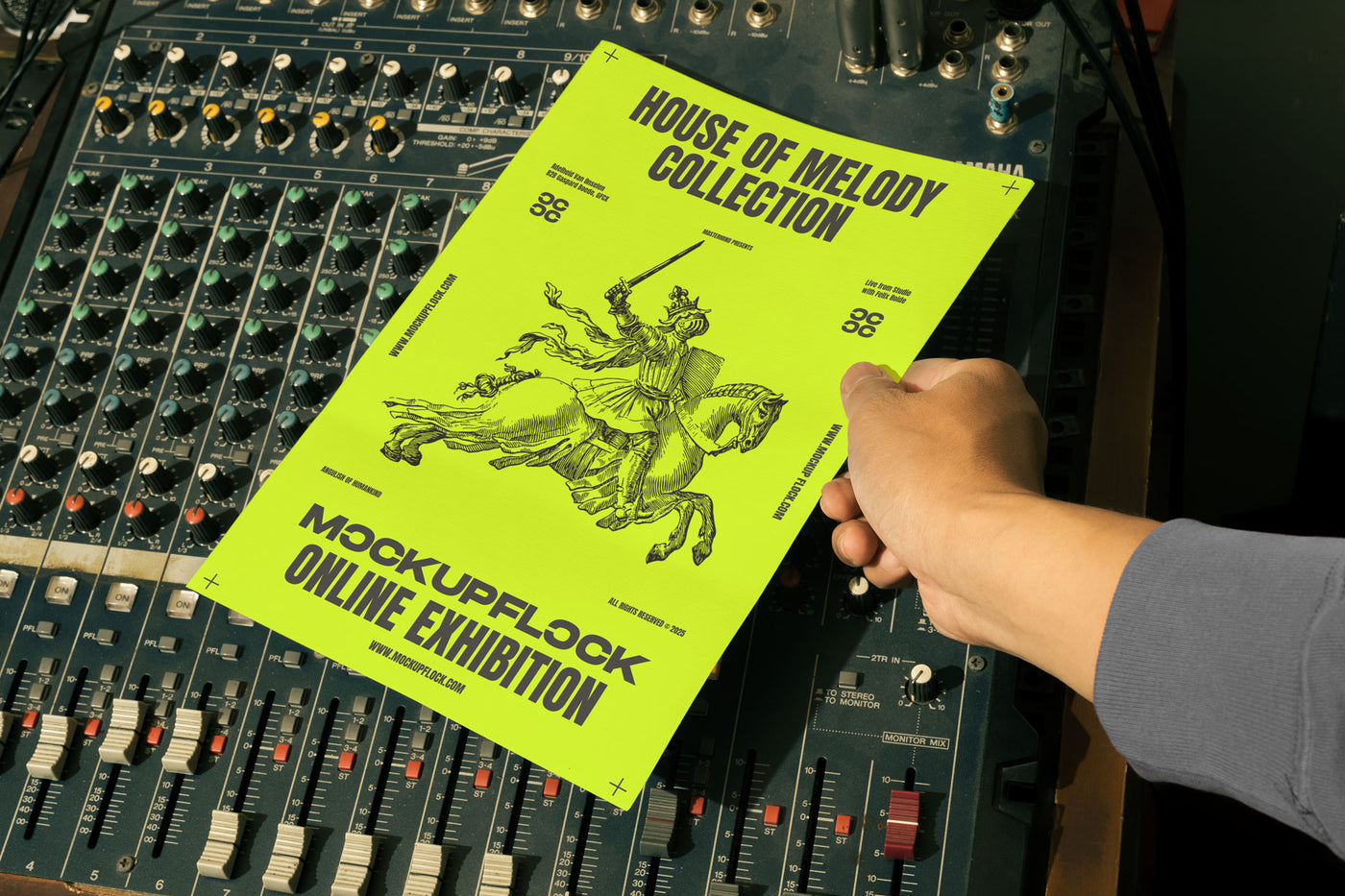 hand holding a poster a4 mockup over an analog mixer