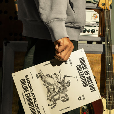 hand holding poster a4 mockup in a music studio