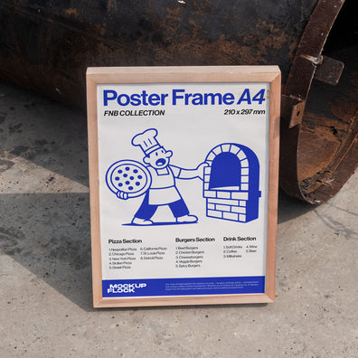 Poster frame mockup leaning on a metal barrel