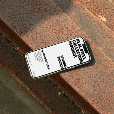 iPhone mockup placed on rusted steel surface 