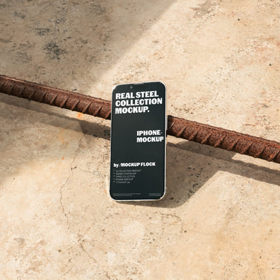 Iphone mockup displayed on a concrete floor with industrial metal rods