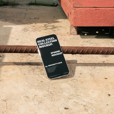 iPhone mockup on a urban rustic metal surface, ideal for design mockups or templates.