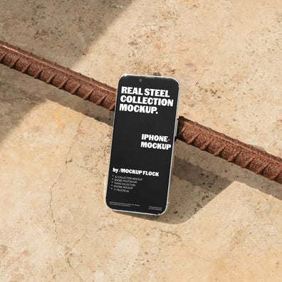 Iphone mockup displayed on a concrete floor with industrial metal rods
