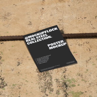 Poster mockup displayed on a concrete floor with industrial metal rods