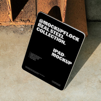 iPad mockup from Mockup Flock Real Steel Collection displayed on concrete floor with industrial rusted steel background for realistic branding presentation.