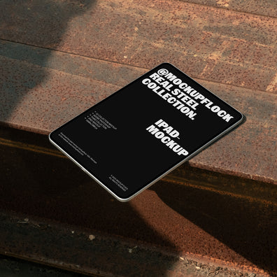 Ipad mockup from Mockup Flock Real Steel Collection placed on rusted steel surface for industrial-style product presentation.