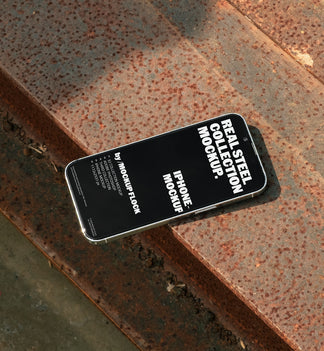 iPhone mockup from Mockup Flock Real Steel Collection placed on rusted steel surface for industrial-style product presentation.