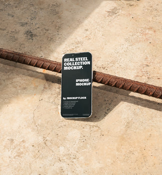 Mockup Flock Real Steel Collection Iphone mockup displayed on a concrete floor with industrial metal rods for realistic product presentation.