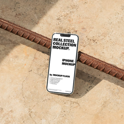 Mockup Flock Real Steel Collection Iphone mockup displayed on a concrete floor with industrial metal rods for realistic product presentation.