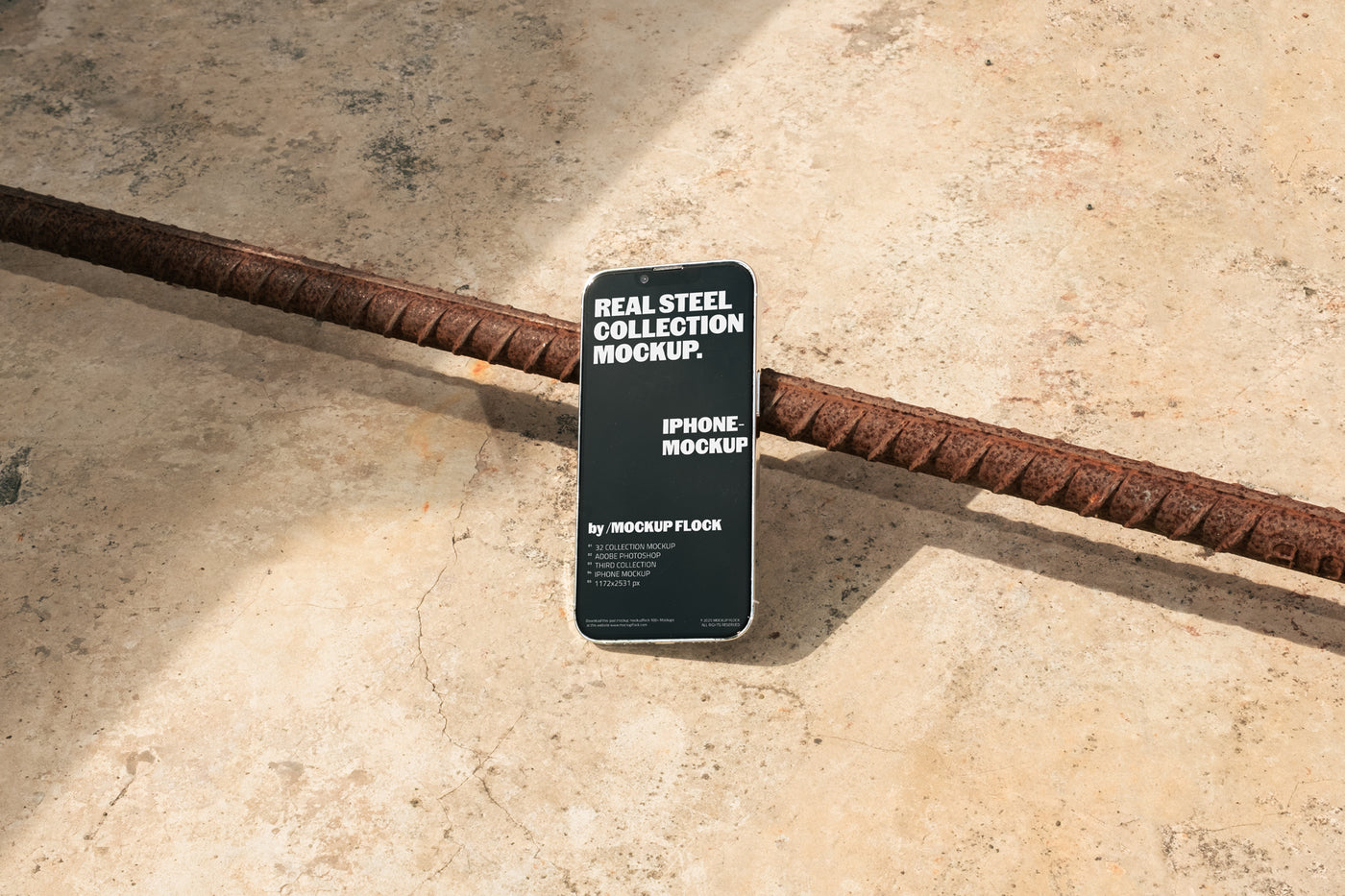 Mockup Flock Real Steel Collection Iphone mockup displayed on a concrete floor with industrial metal rods for realistic product presentation.