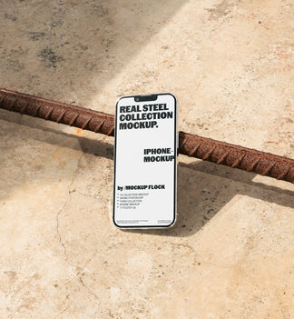 Mockup Flock Real Steel Collection Iphone mockup displayed on a concrete floor with industrial metal rods for realistic product presentation.