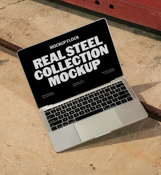 Mockup Flock Real Steel Collection MacBook mockup displayed on a concrete floor with industrial metal rods for realistic product presentation.