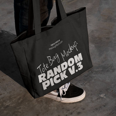 urban tote bag mockup lying on top of black shoes