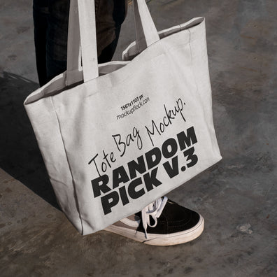 urban tote bag mockup lying on top of black shoes