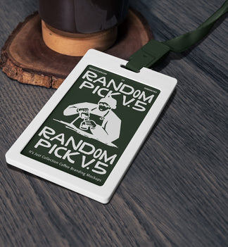 White ID badge card with dark green lanyard lying flat on a textured wooden surface next to a coffee grinder base, top angle flat lay mockup for cafe branding