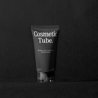 A matte black cosmetic tube with white text reading 'Cosmetic Tube.' and smaller text below, standing upright on a dark surface against a dark background.