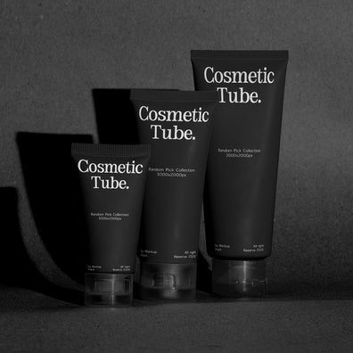 Three black cosmetic tubes labeled 'Cosmetic Tube.' standing on a dark surface against a dark gray background, with dramatic side shadows.