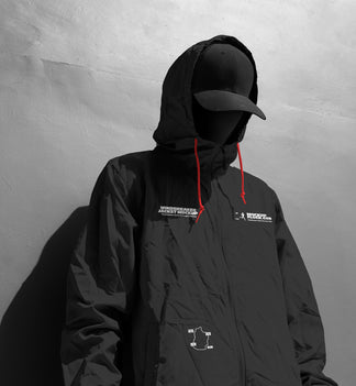 Black and white close-up hooded jacket mockup front view with chest logo and yellow drawstrings