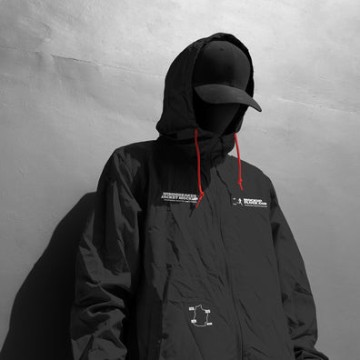 Black and white close-up hooded jacket mockup front view with chest logo and yellow drawstrings
