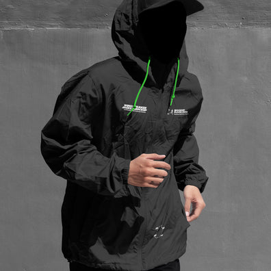 Black and white hooded jacket mockup front view with illustrated smiley face overlay on hood
