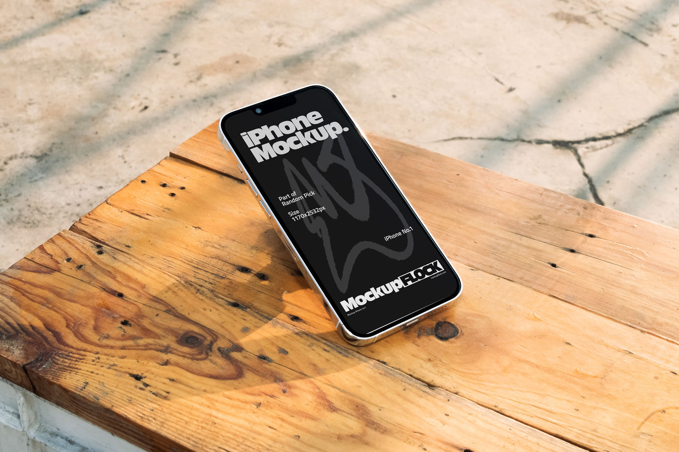 Flat lay view of a black iPhone mockup placed on a rustic wooden table under natural sunlight