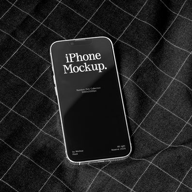A smartphone mockup with a black screen displaying the text 'iPhone Mockup.' in white, resting on a black plaid fabric background.