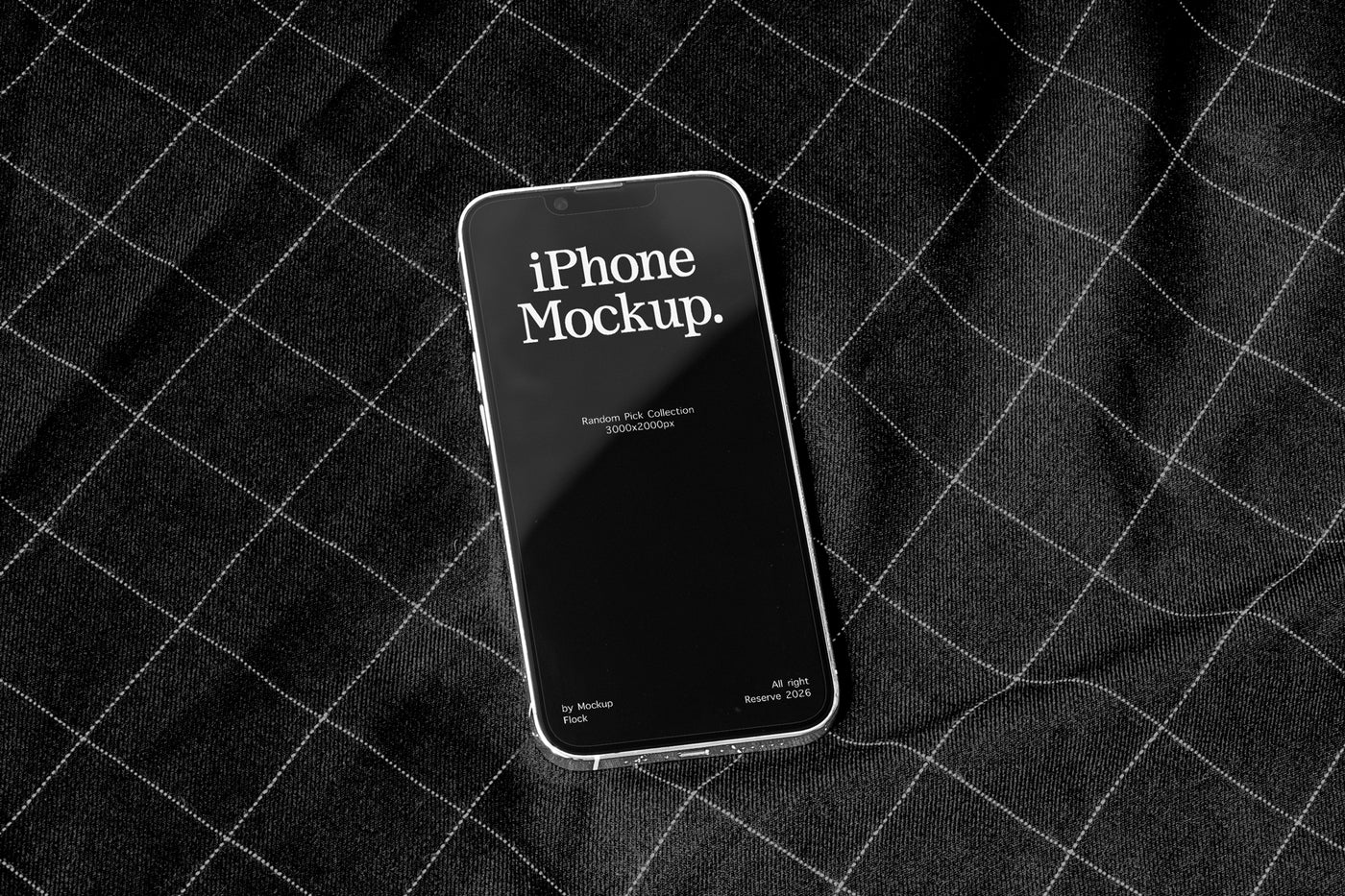 A smartphone mockup with a black screen displaying the text 'iPhone Mockup.' in white, resting on a black plaid fabric background.