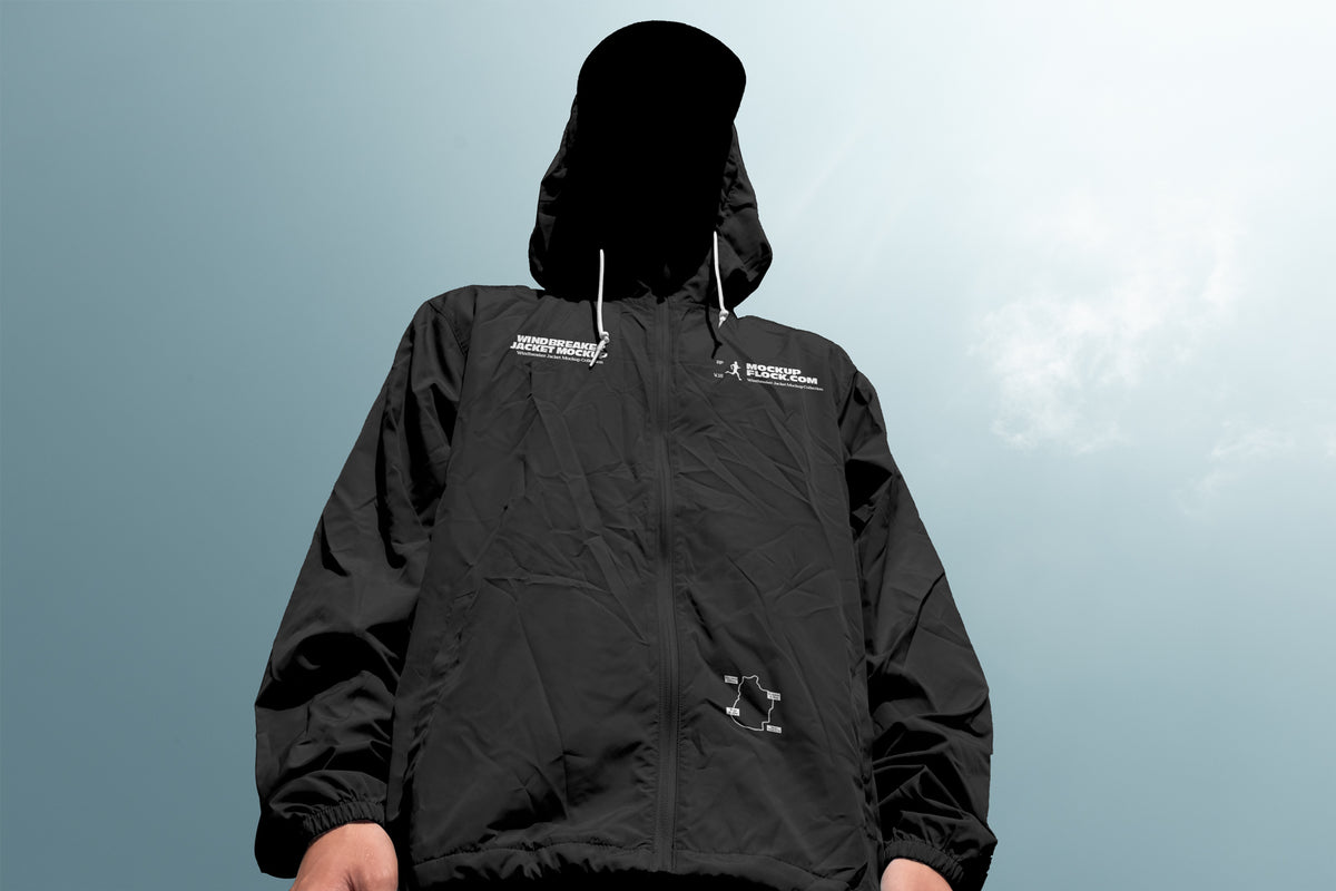 Black windbreaker jacket mockup low angle front view against sky