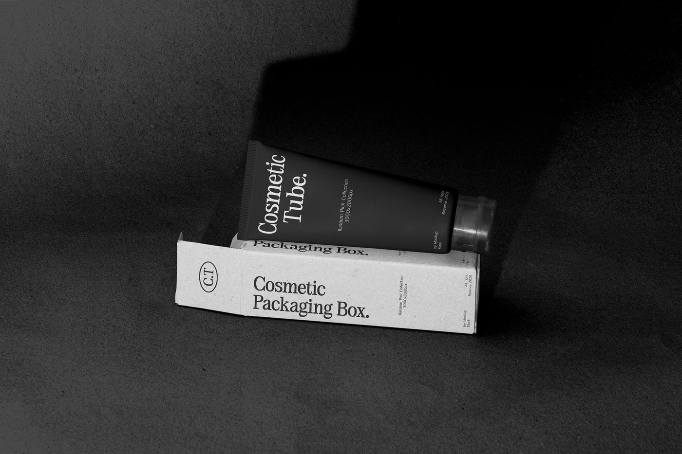 Black cosmetic tube leaning on White packaging box mockup, terracotta studio backdrop