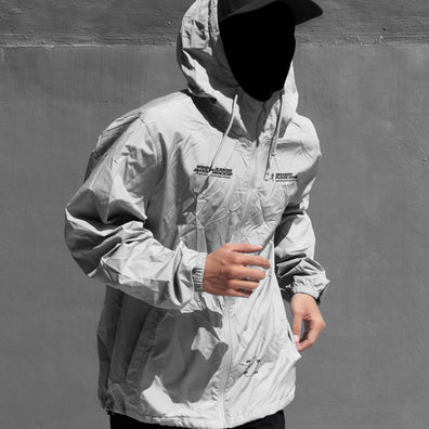 Black and white hooded jacket mockup front view with illustrated smiley face overlay on hood