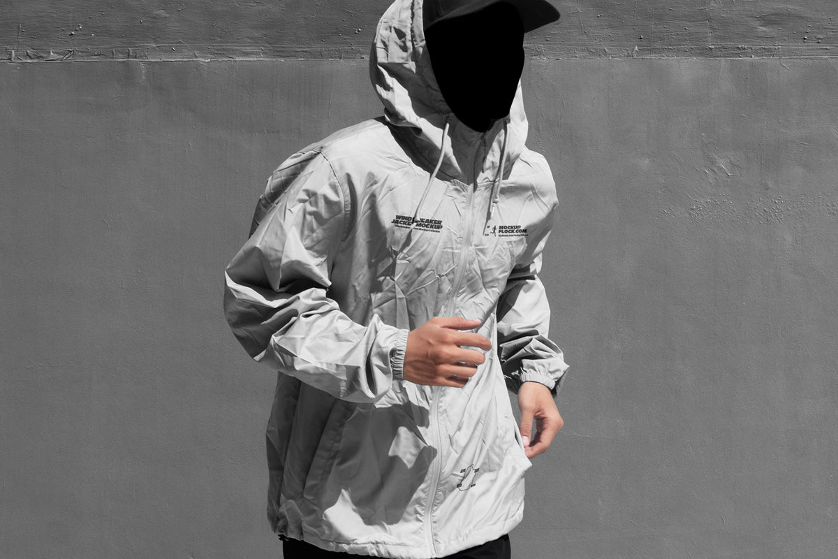 Black and white hooded jacket mockup front view with illustrated smiley face overlay on hood