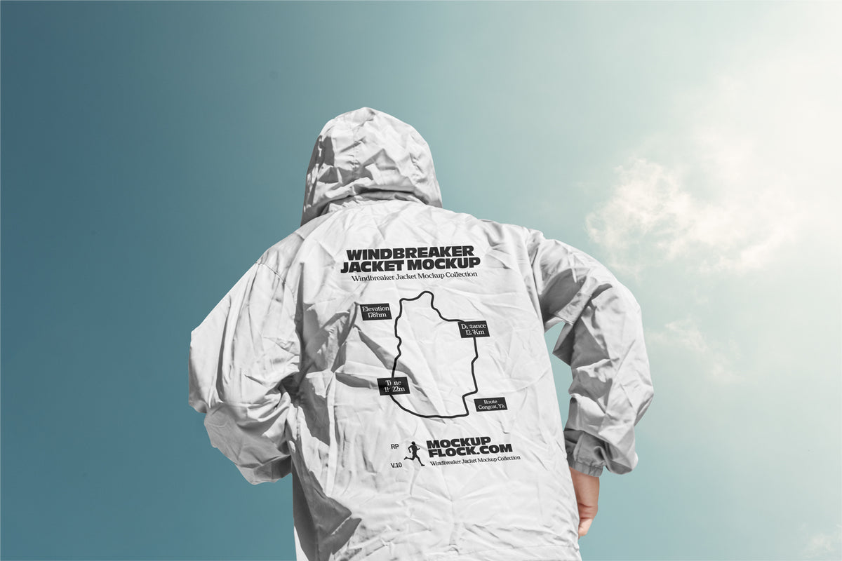 Black hooded jacket mockup back view against a gradient blue sky with clouds