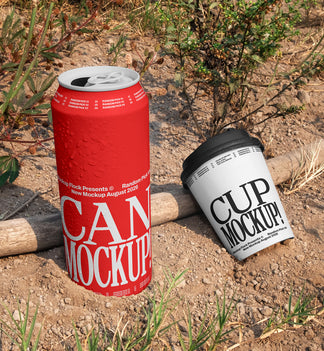 Red aluminum can and white paper coffee cup mockup placed on dry dirt ground with wild plants in the background