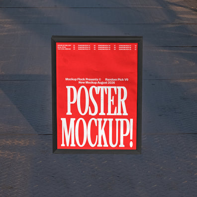 Black framed poster mockup standing upright on a dark textured metal floor with soft shadow overlay