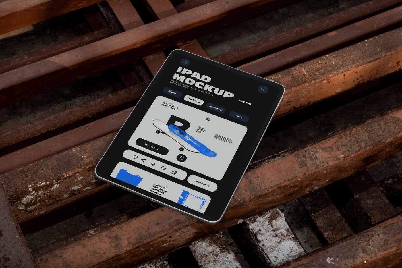 iPad mockup lying at an angle on rusty industrial metal grates outdoors, screen displaying app UI design, dark urban street style