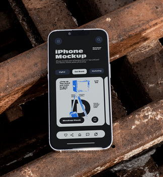iPhone lying flat face-up on rusty industrial metal grates outdoors in bright daylight, showing app UI mockup design, dark urban industrial style