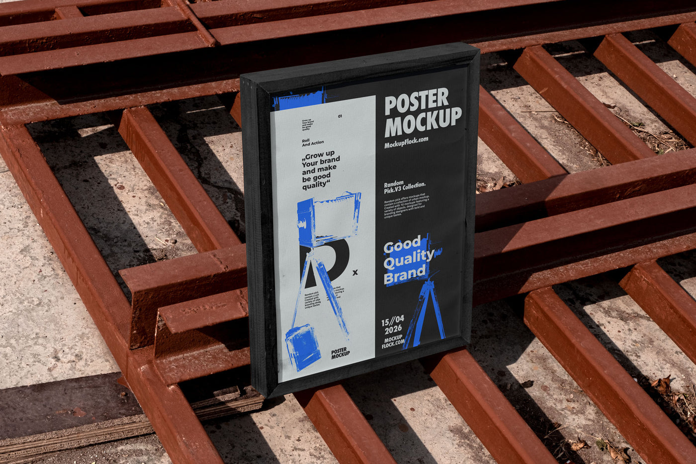 Black framed poster mockup standing upright on rusty industrial metal grates outdoors in harsh sunlight, bold two-panel graphic design, urban street aesthetic