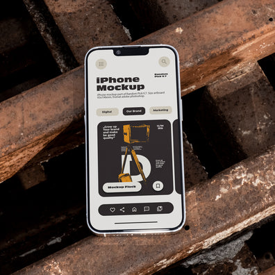 iPhone lying flat face-up on rusty industrial metal grates outdoors in bright daylight, showing app UI mockup design, dark urban industrial style
