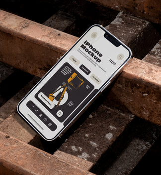 iPhone mockup lying tilted diagonally on rusty metal industrial grates outdoors in harsh daylight, showing app UI design, urban street style